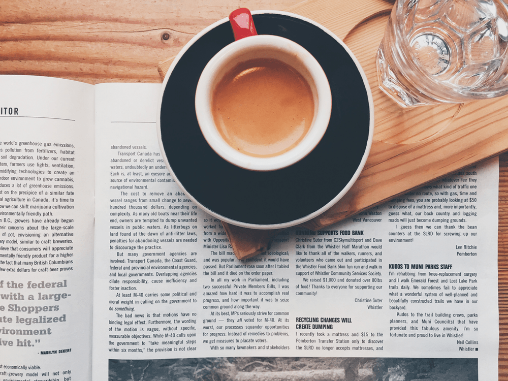 cup of coffee on a news paper