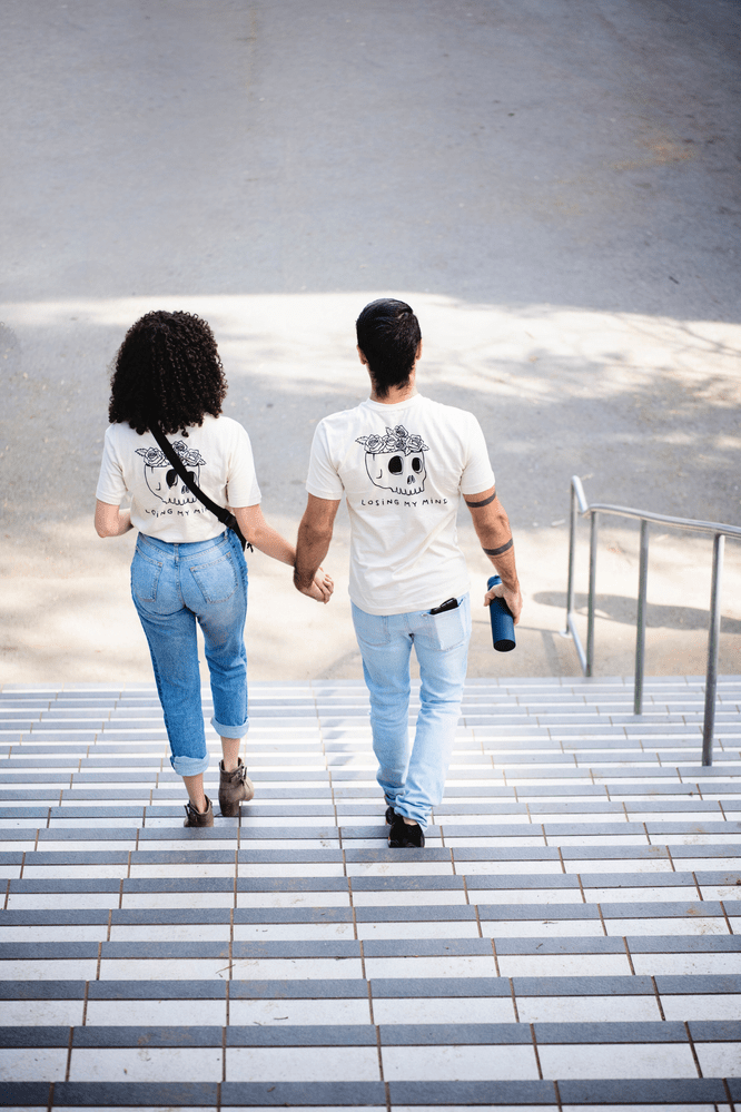 couple walking down the stairs holding hands